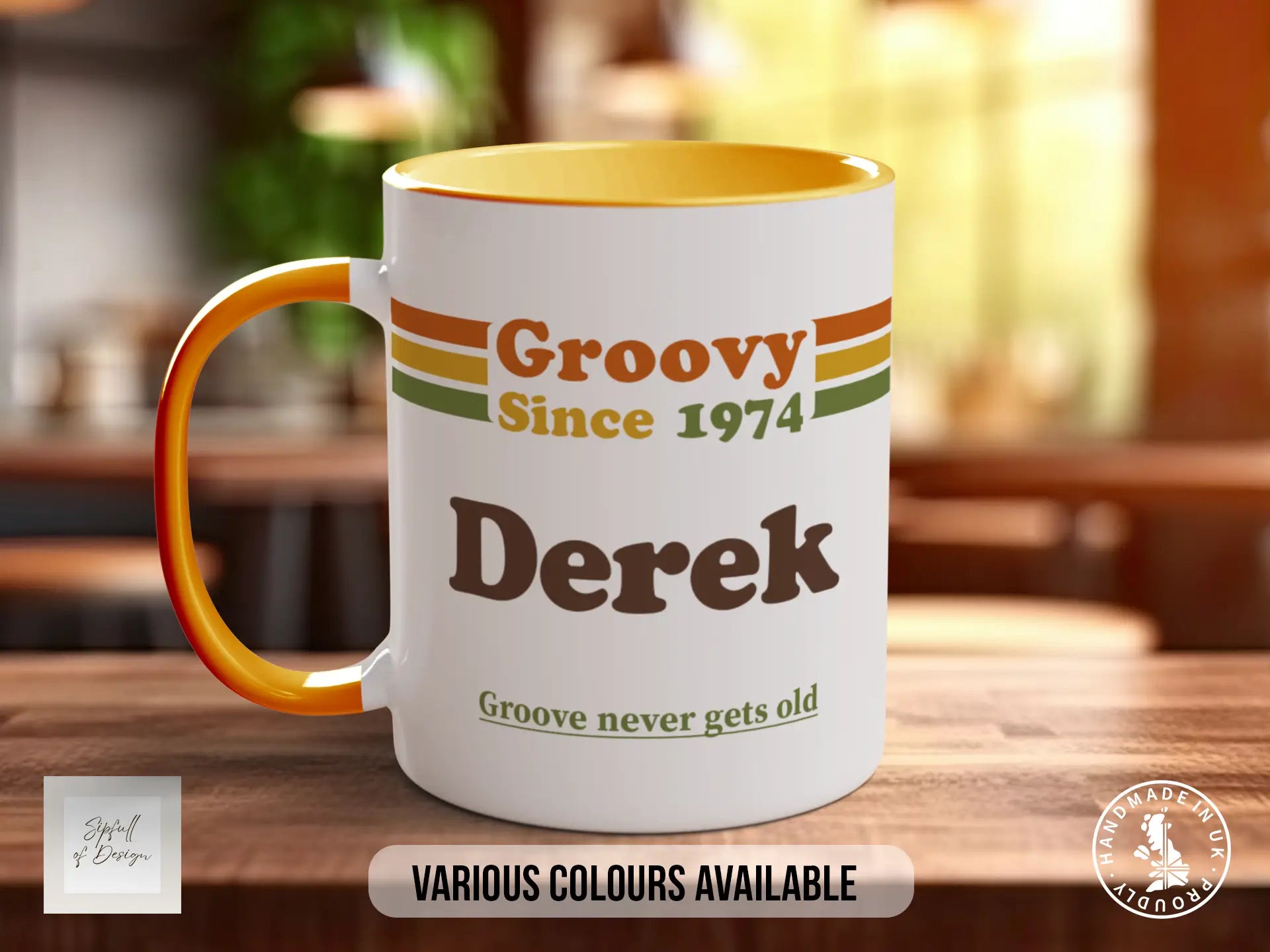 A white mug with an orange handle, featuring text and a graphic design, placed on a wooden surface.