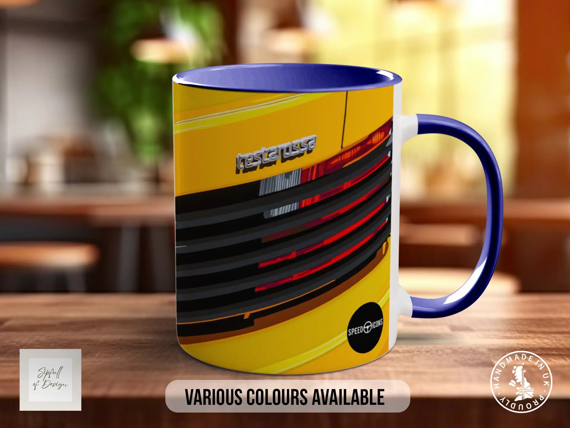 A yellow and blue mug with a graphic design featuring a car or vehicle. The mug is placed on a wooden surface, and there is text indicating that various colors are available.