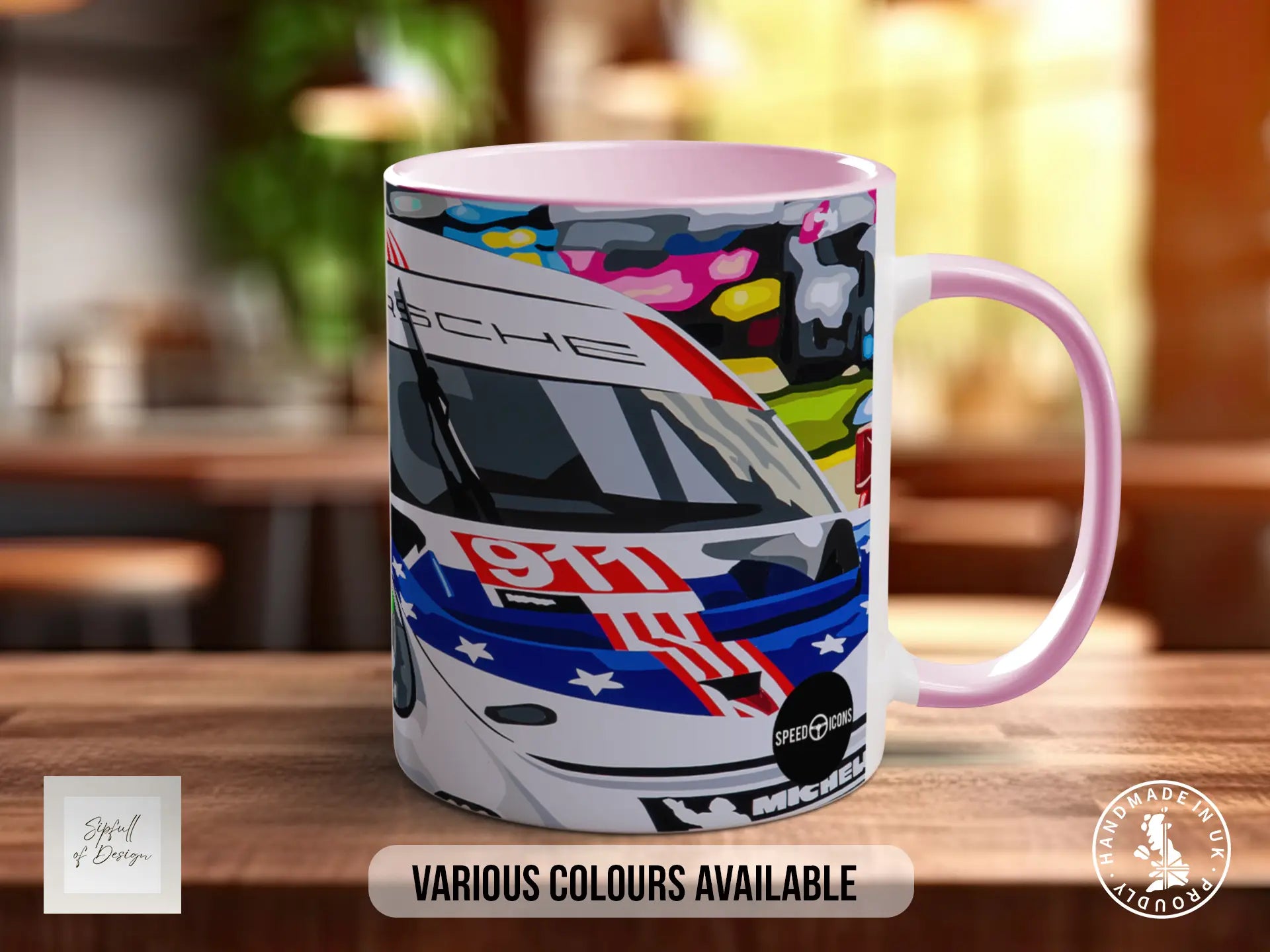 A mug with a colorful racing car design on it, placed on a wooden surface.