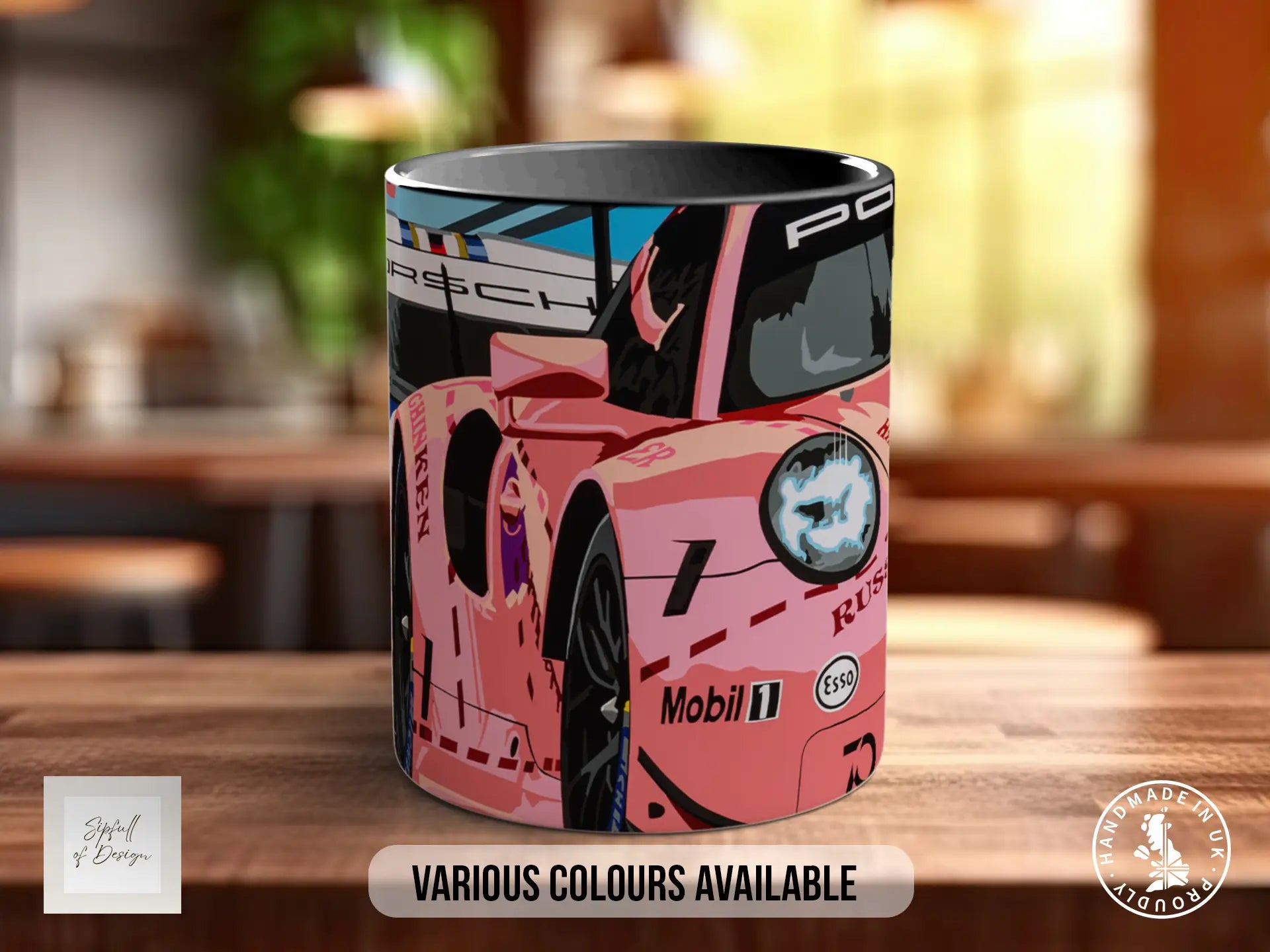 A pink sports car mug with a racing car design, placed on a wooden surface.