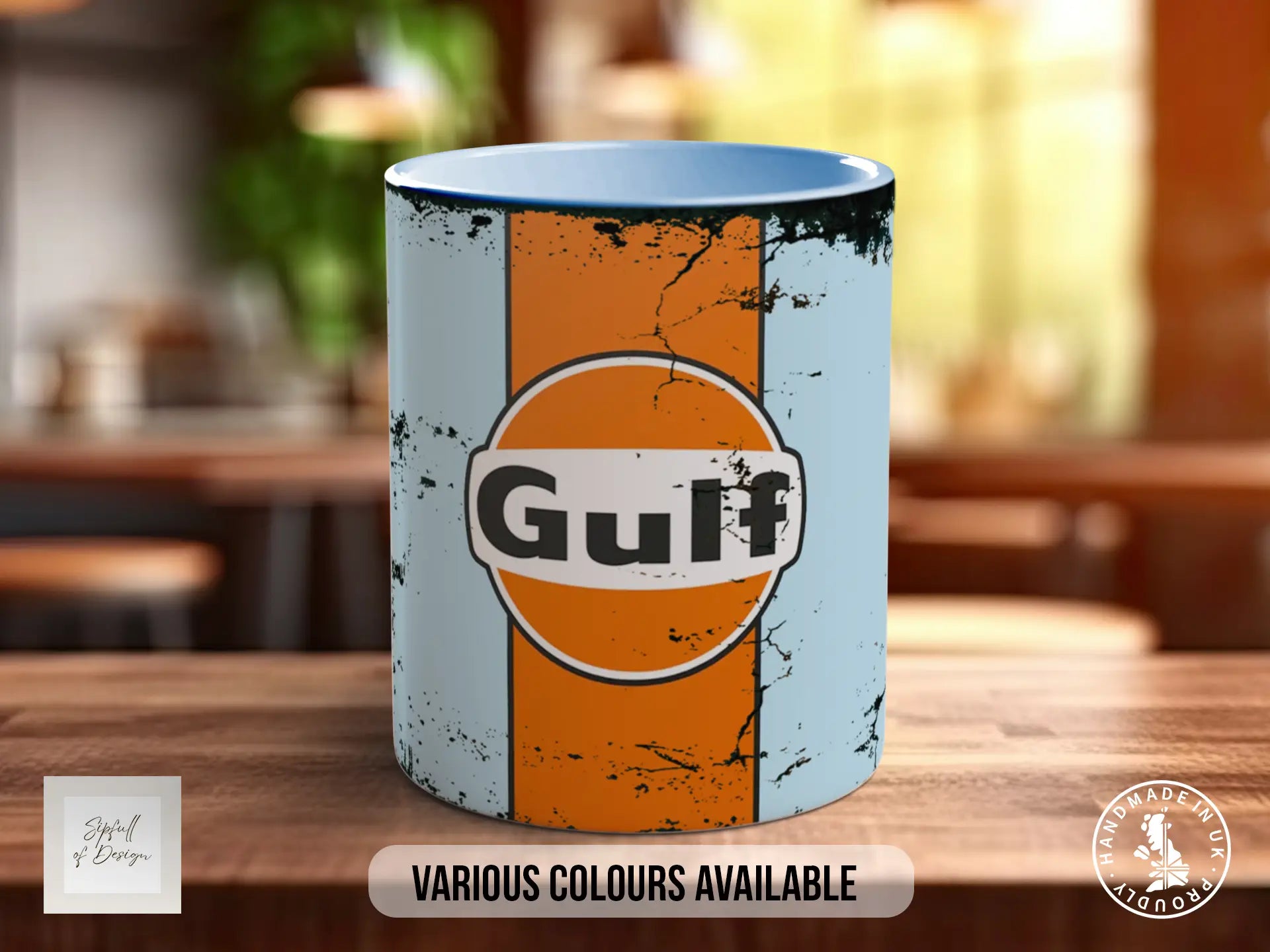 A ceramic mug with a distressed, orange and white design featuring the word "Gulf" on it, placed on a wooden surface.