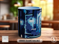 A blue mug with a graphic design on it, sitting on a wooden surface.