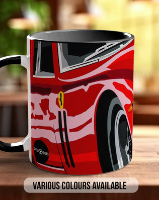 A red and black mug with a graphic design of a car on it, sitting on a wooden surface.
