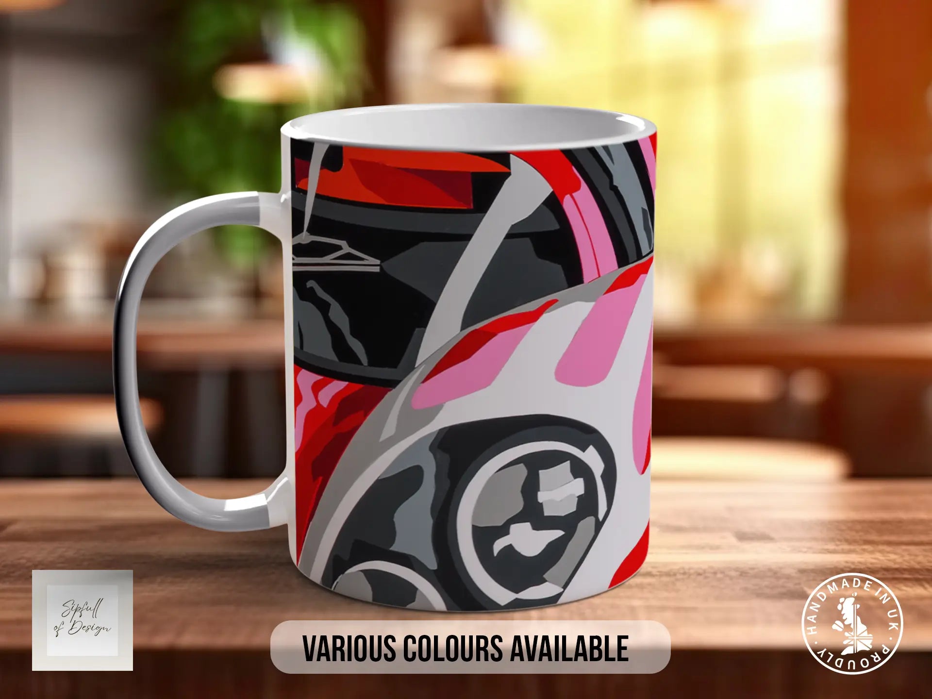 A colorful mug with a graphic design featuring a car or vehicle on the front.