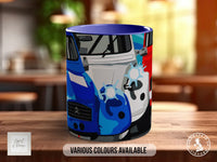 A colorful mug with a graphic design of a car on it, placed on a wooden surface.
