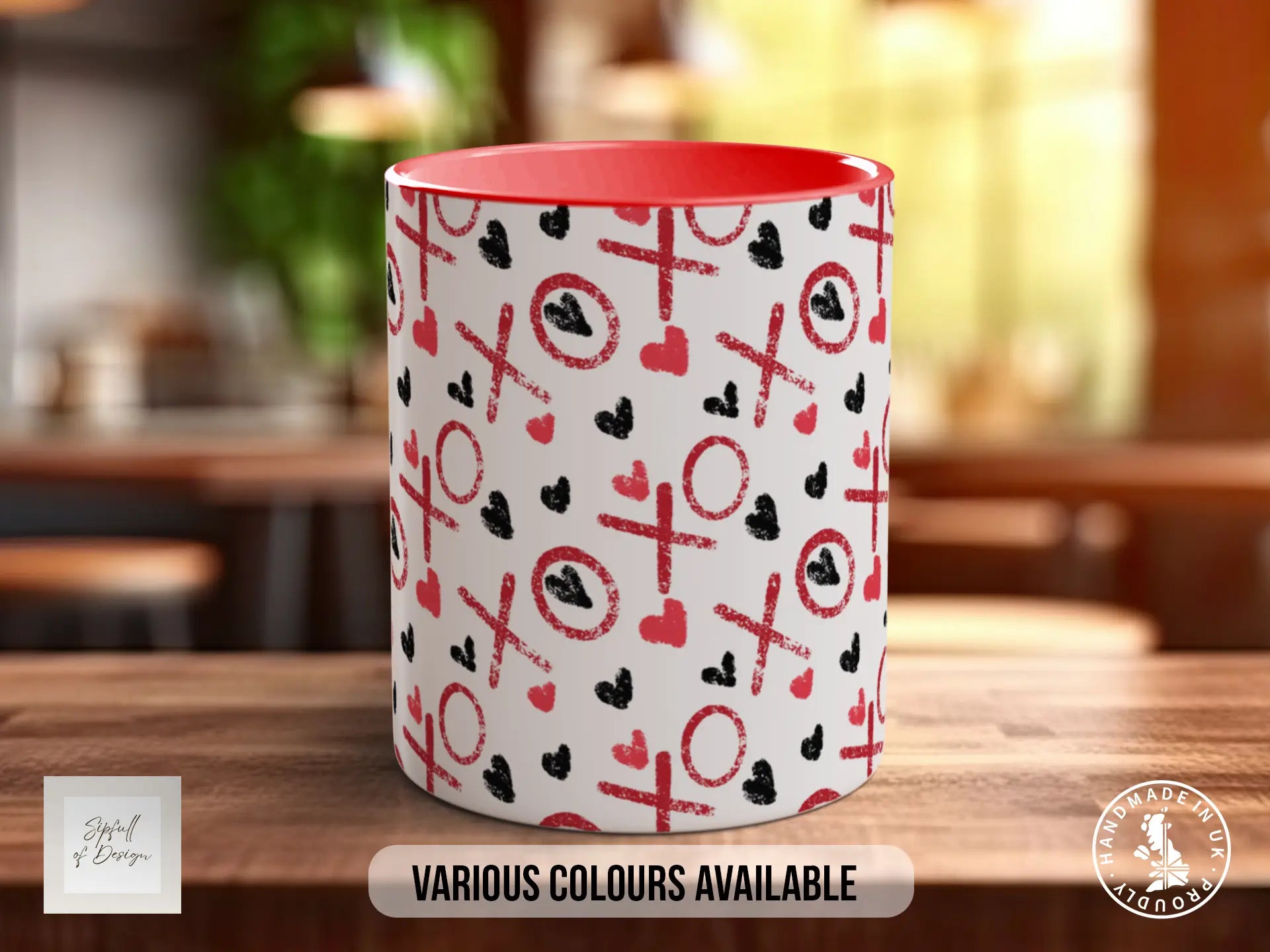 A red and white mug with a pattern of red x's and black hearts on a white background.