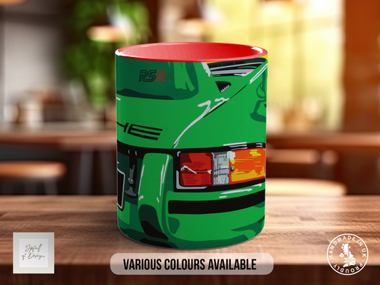 A green mug with a red rim, featuring an illustration of a car on the front.