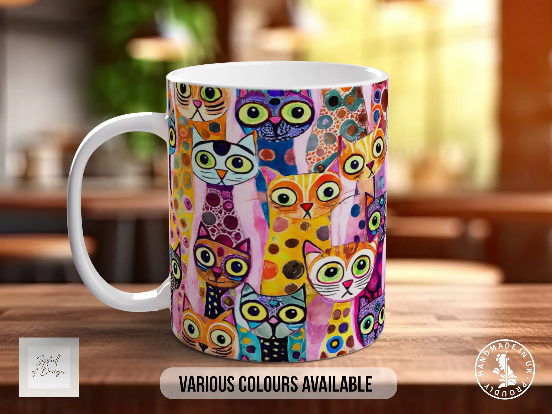 A colorful mug with a playful cat design printed on it, sitting on a wooden surface.