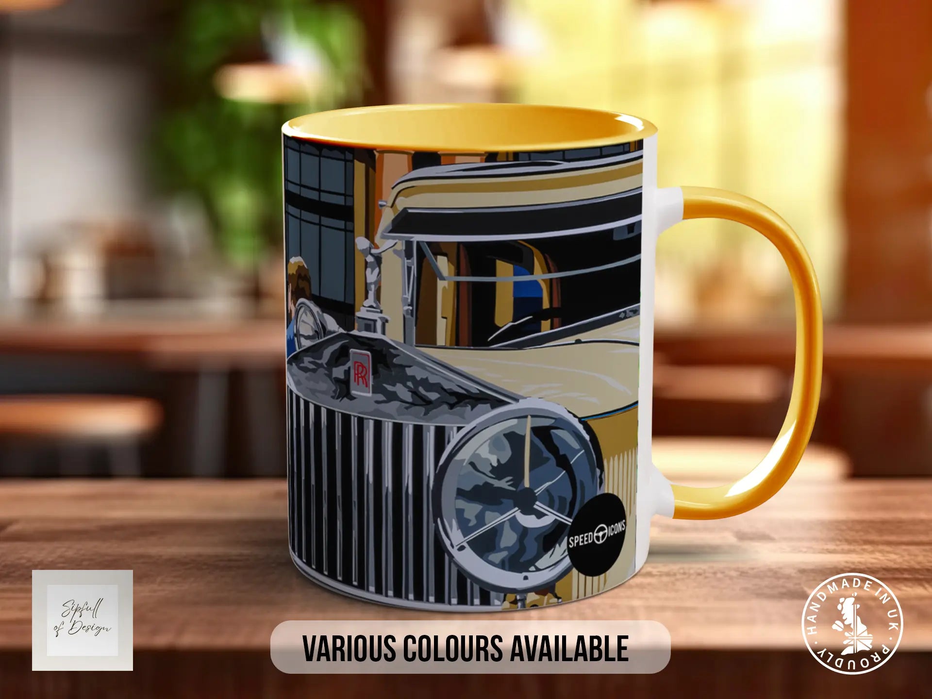 A colorful mug with an illustration of a classic car on it, placed on a wooden surface.