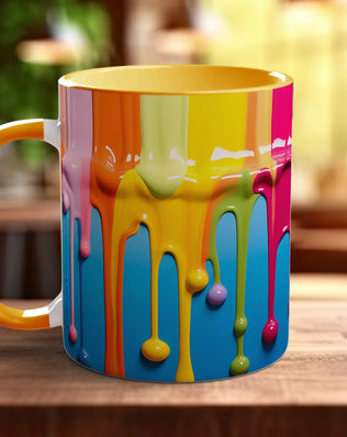 A colorful coffee mug with a dripping paint design, sitting on a wooden surface.