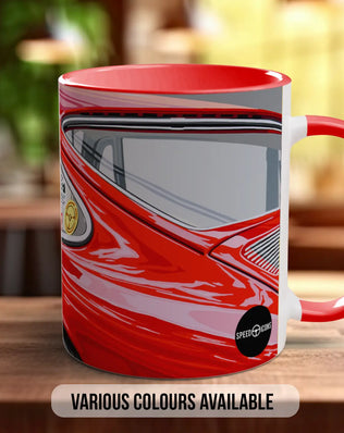 A red and white mug with a graphic of a car on it, placed on a wooden surface.