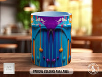 A colorful mug with a vibrant abstract design featuring blue, orange, and purple colors, placed on a wooden surface.