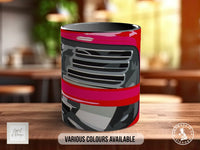 A mug with a graphic design featuring a car or vehicle, likely a sports car or luxury vehicle, in shades of red, black, and gray.