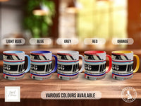 a row of five colorful mugs, each with a different color and design, arranged on a wooden surface.