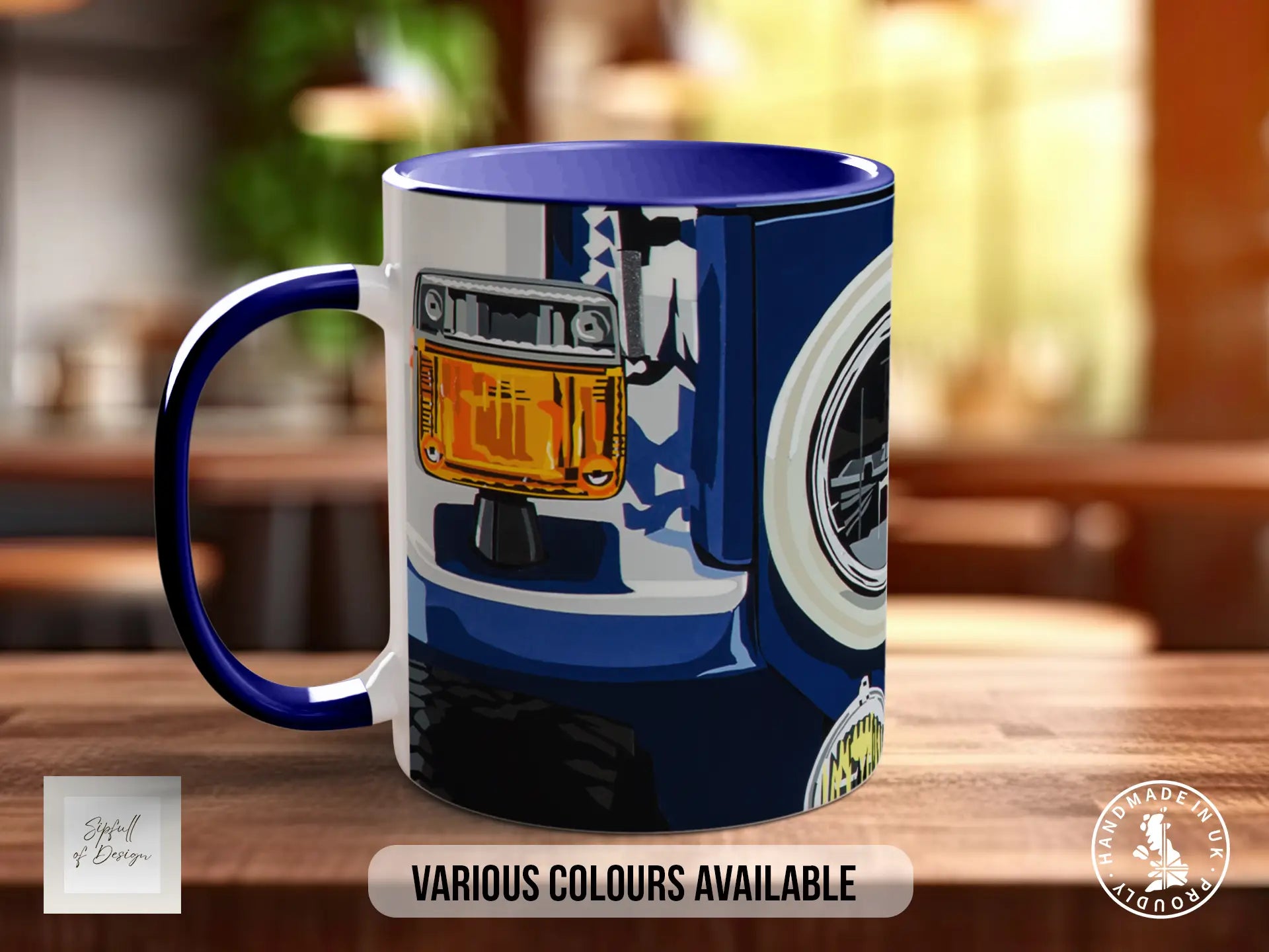A blue and white mug with an illustration of a vehicle on it, placed on a wooden surface.