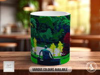 A mug with a colorful illustration of a person sitting on a bench in a park, surrounded by trees and greenery.