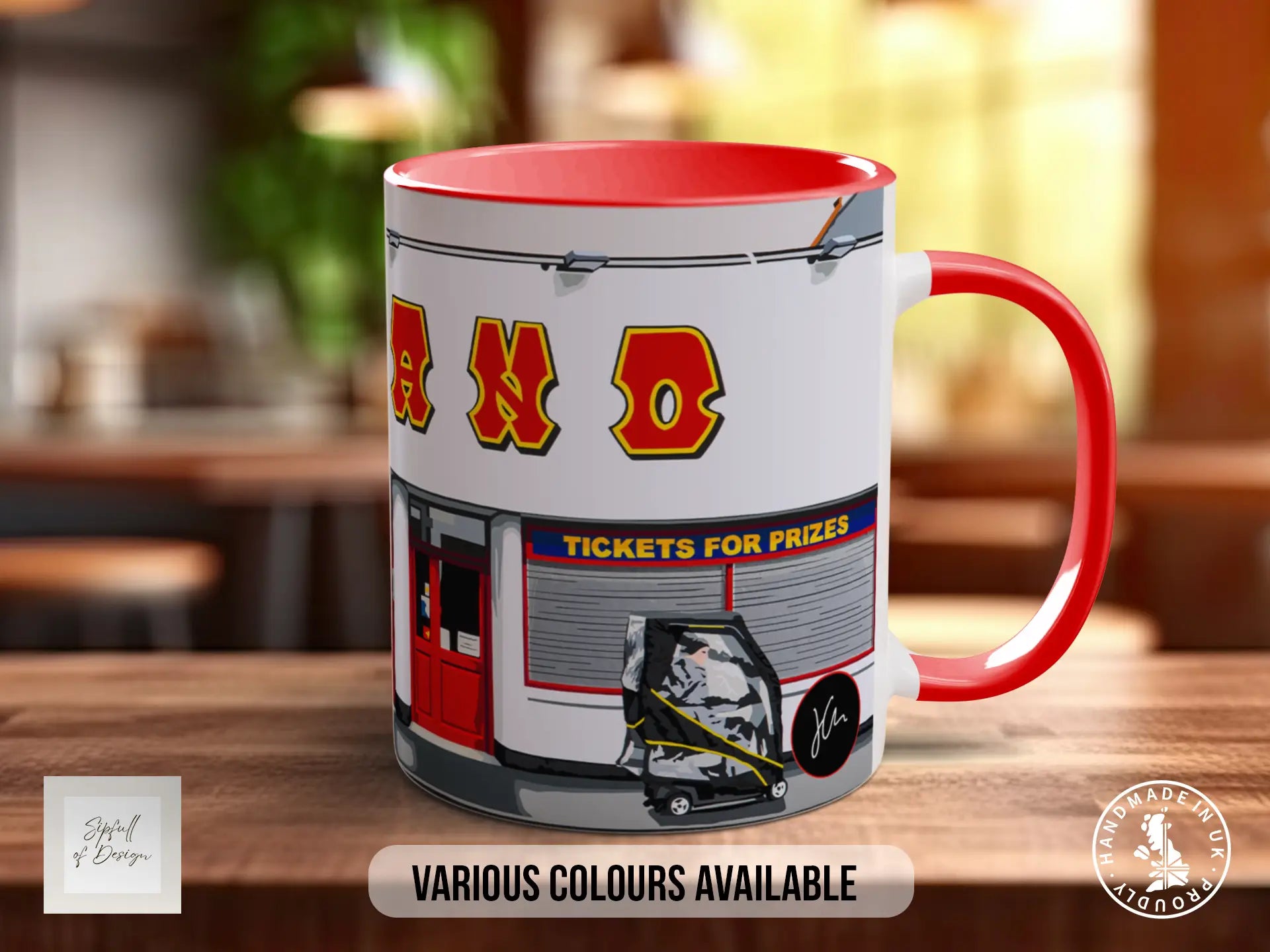 A red and white mug with the word "ANO" printed on it, along with an illustration of a ticket booth and a person.