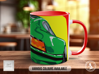 A colorful mug with a graphic of a car on it, placed on a wooden surface.