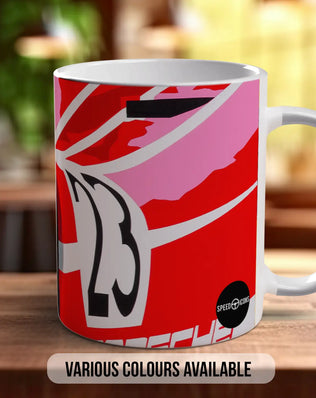 A white ceramic mug with a vibrant red and pink abstract design, featuring the number 23 prominently displayed. The mug is placed on a wooden surface, and there is text indicating that various colors are available.