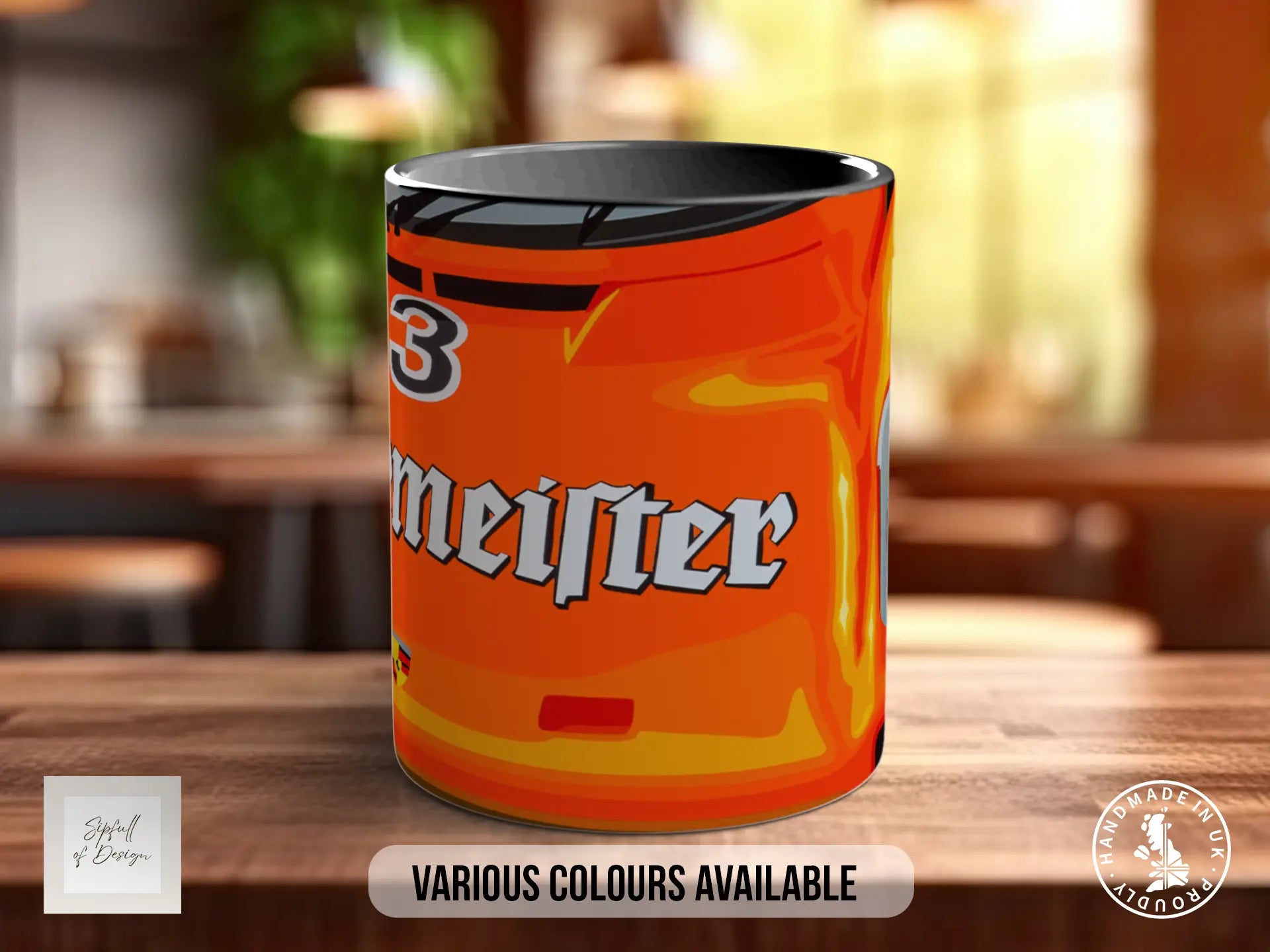 a mug with an orange and yellow design, sitting on a wooden surface.