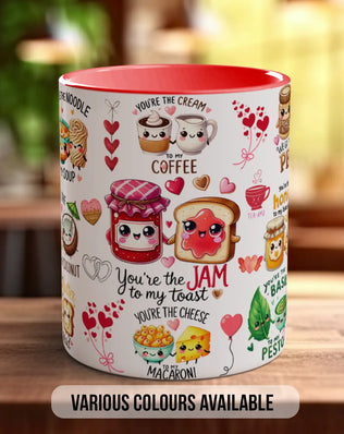 A white mug with a variety of colorful illustrations and text on it, placed on a wooden surface.