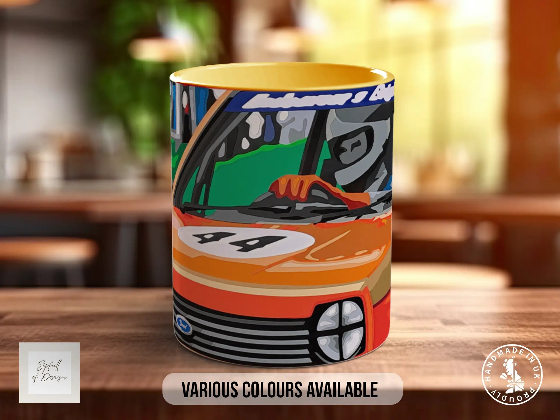 A colorful mug with an illustration of a race car on it, placed on a wooden surface.