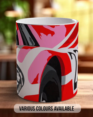 A colorful mug with a vibrant abstract design, placed on a wooden surface.