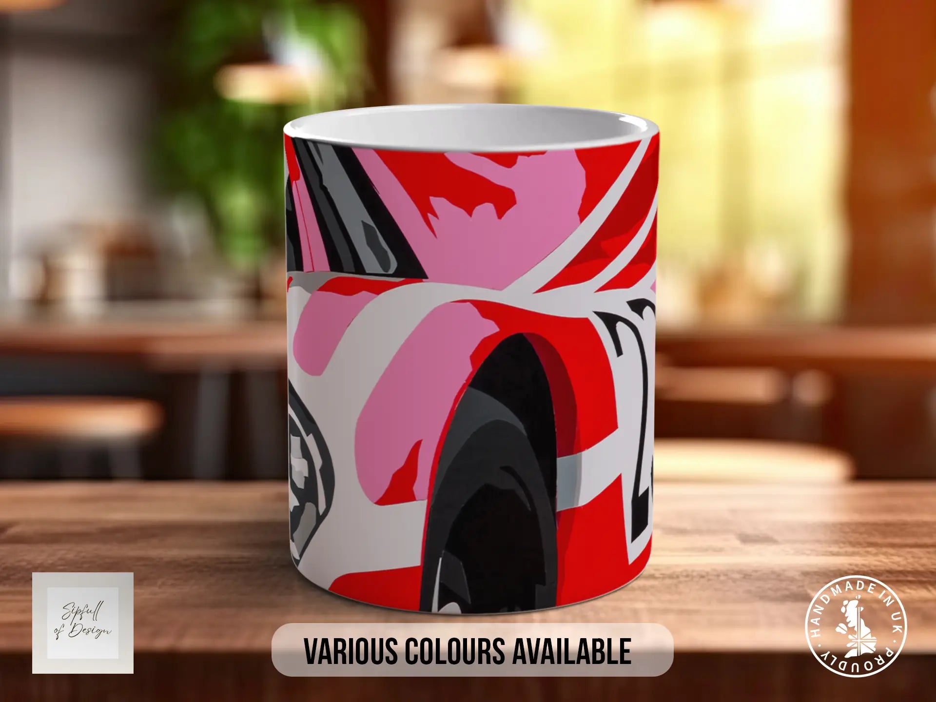 A colorful mug with a vibrant abstract design, placed on a wooden surface.