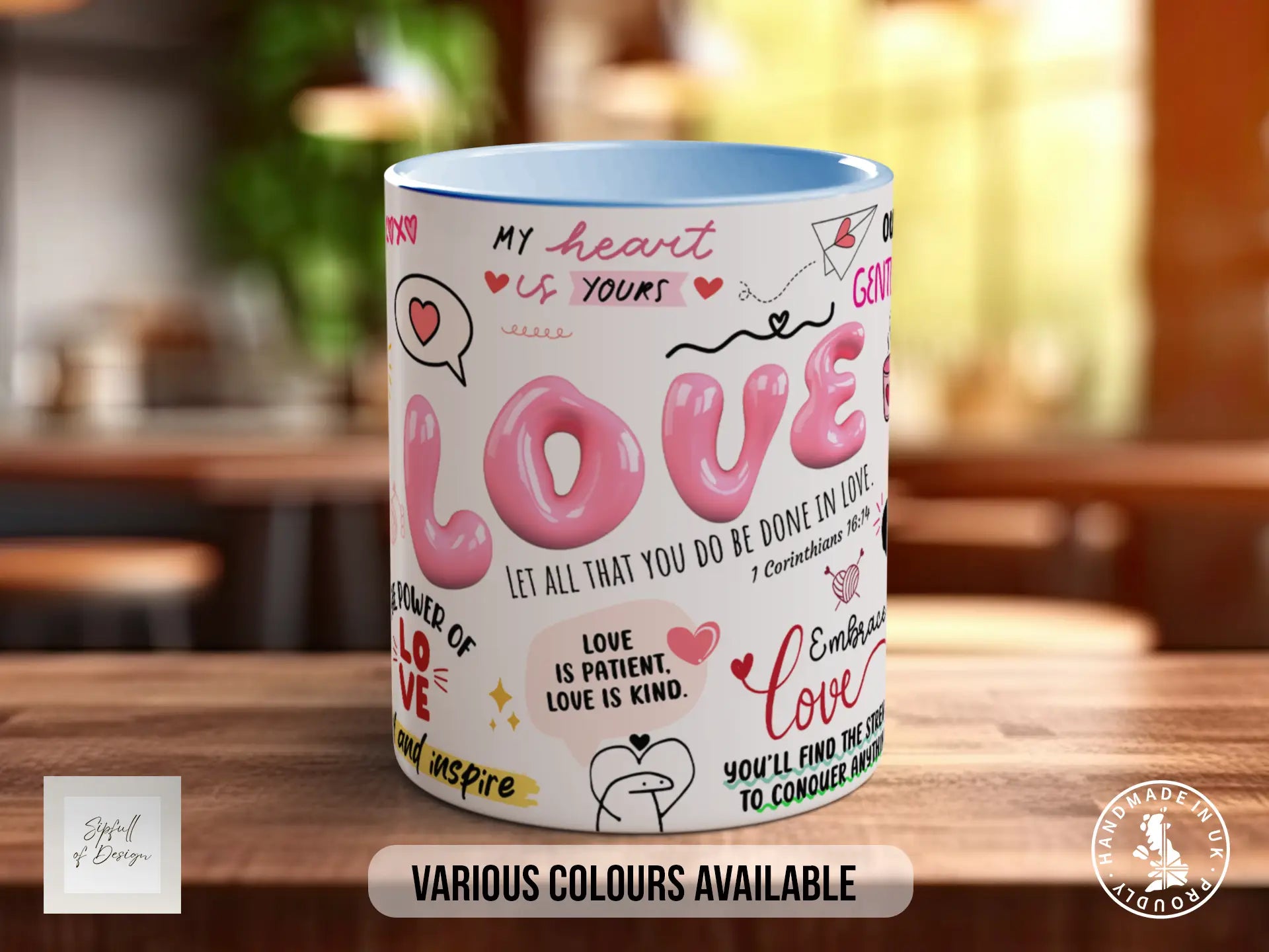 A white mug with the word "LOVE" written on it, surrounded by various phrases and illustrations in pink and red colors.