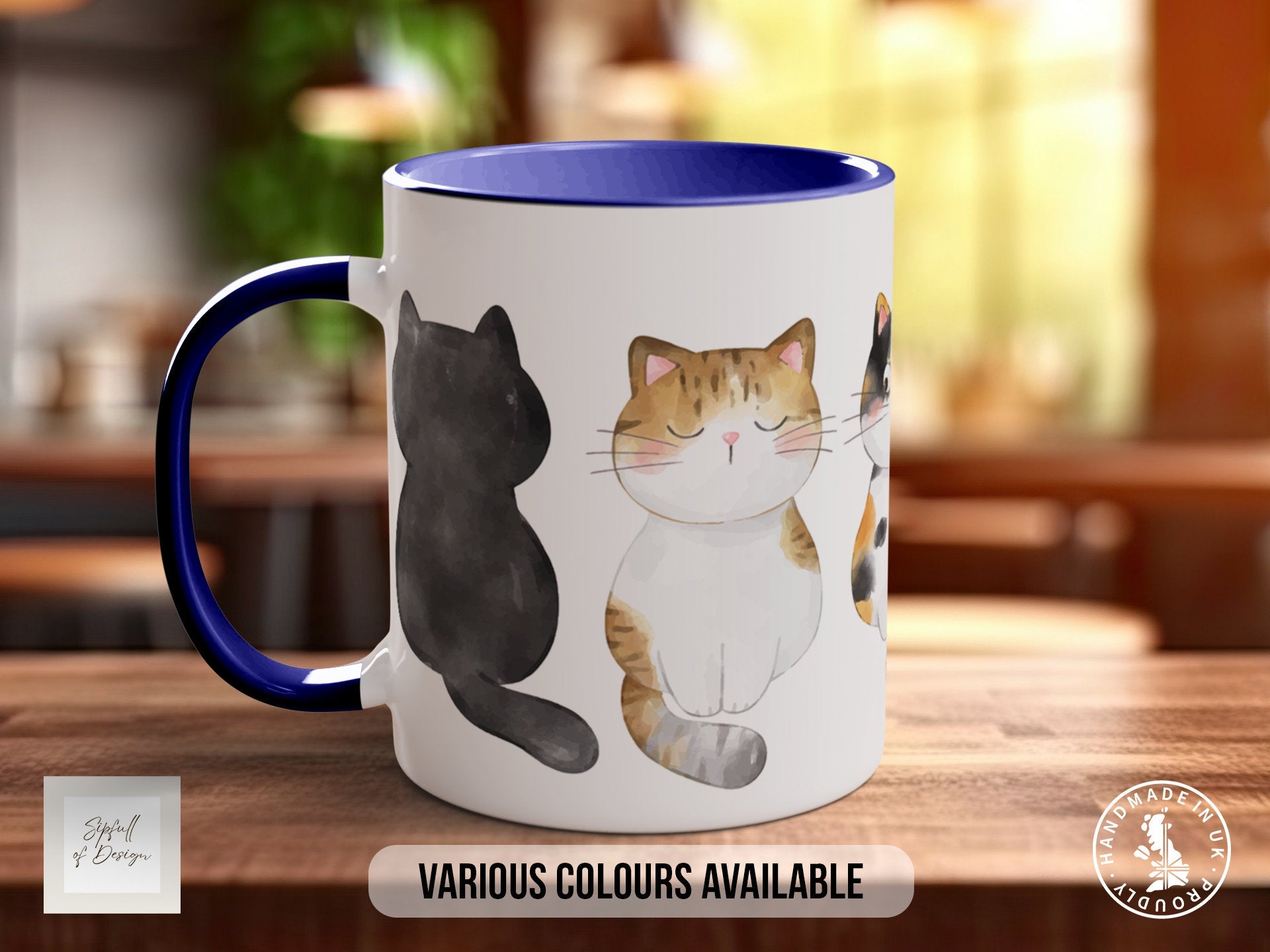 a coffee mug with a picture of two cats on it