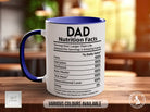 a blue and white coffee mug sitting on top of a wooden table