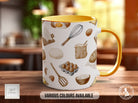 a yellow and white coffee mug sitting on top of a wooden table