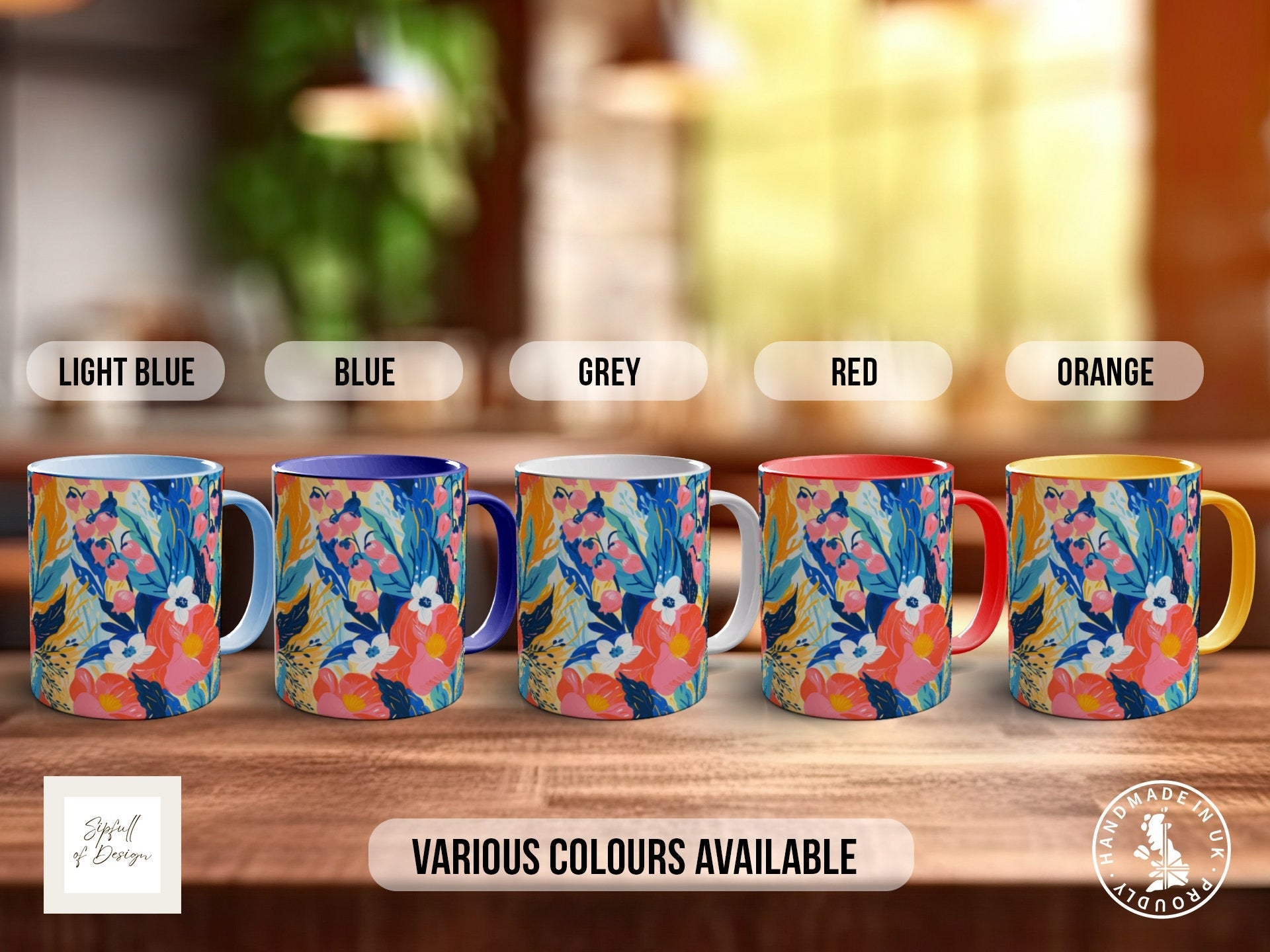 a set of four colorful coffee mugs sitting on top of a wooden table