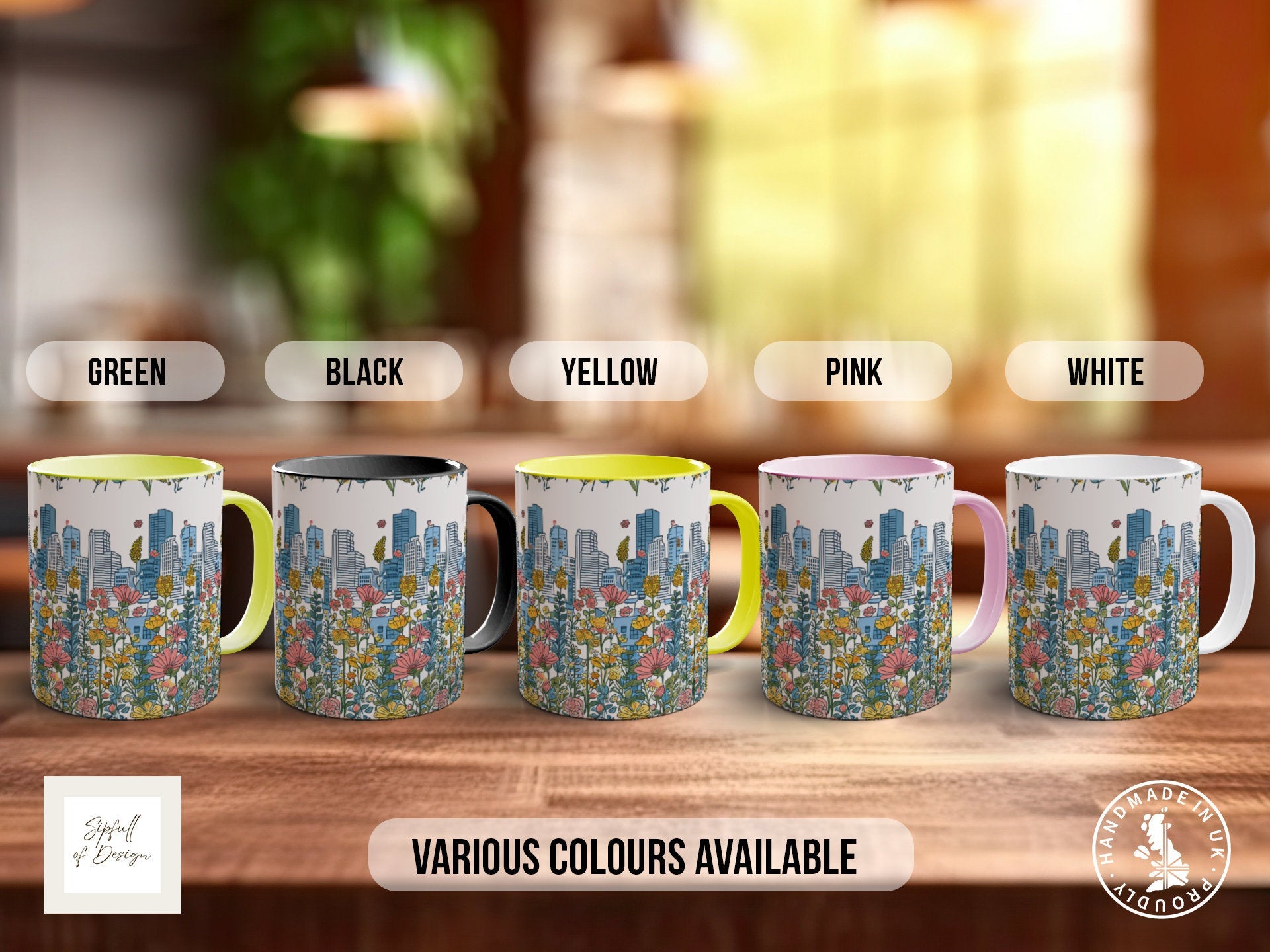 a group of four coffee mugs sitting on top of a wooden table