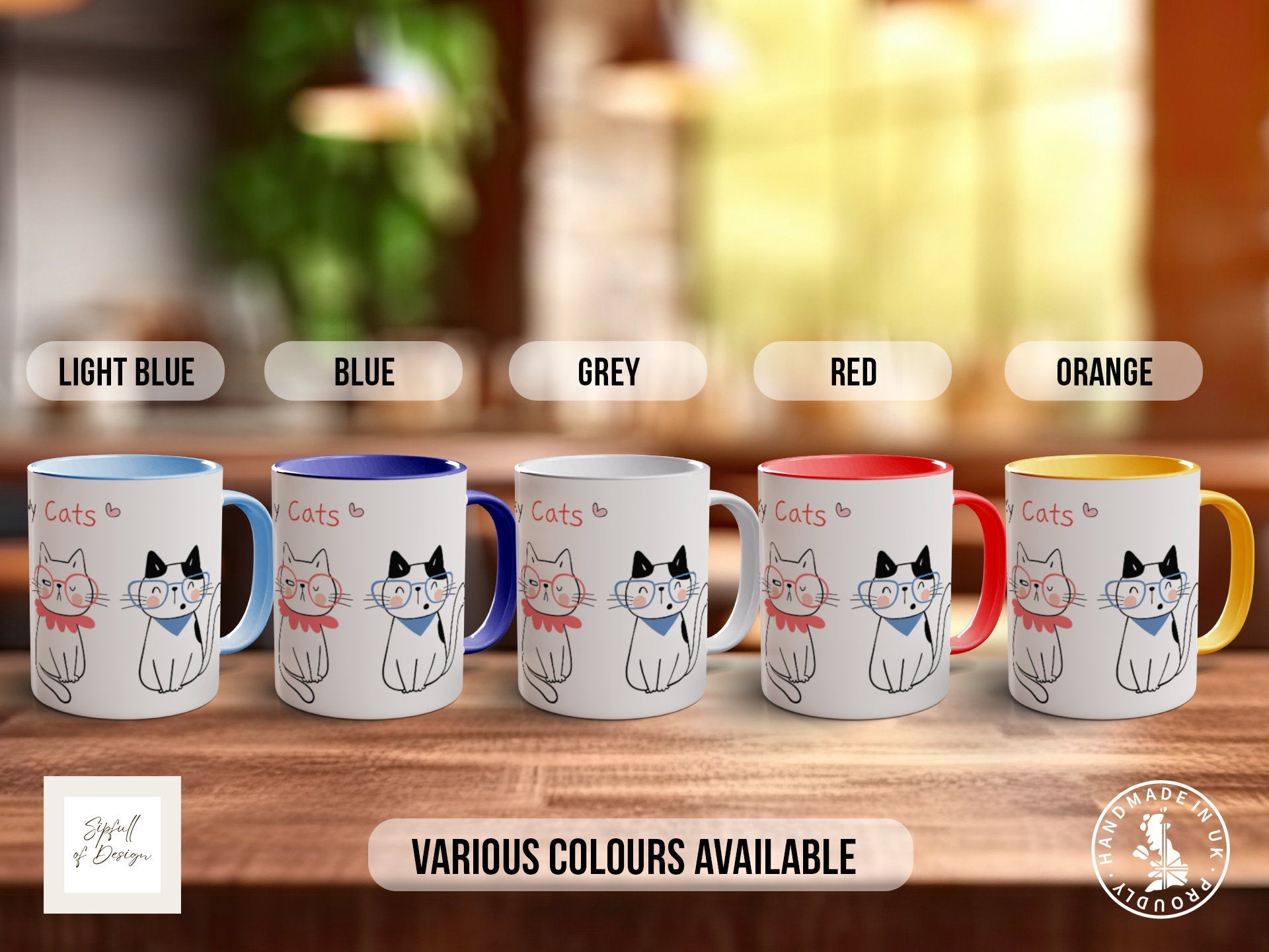 a set of four coffee mugs with cats on them