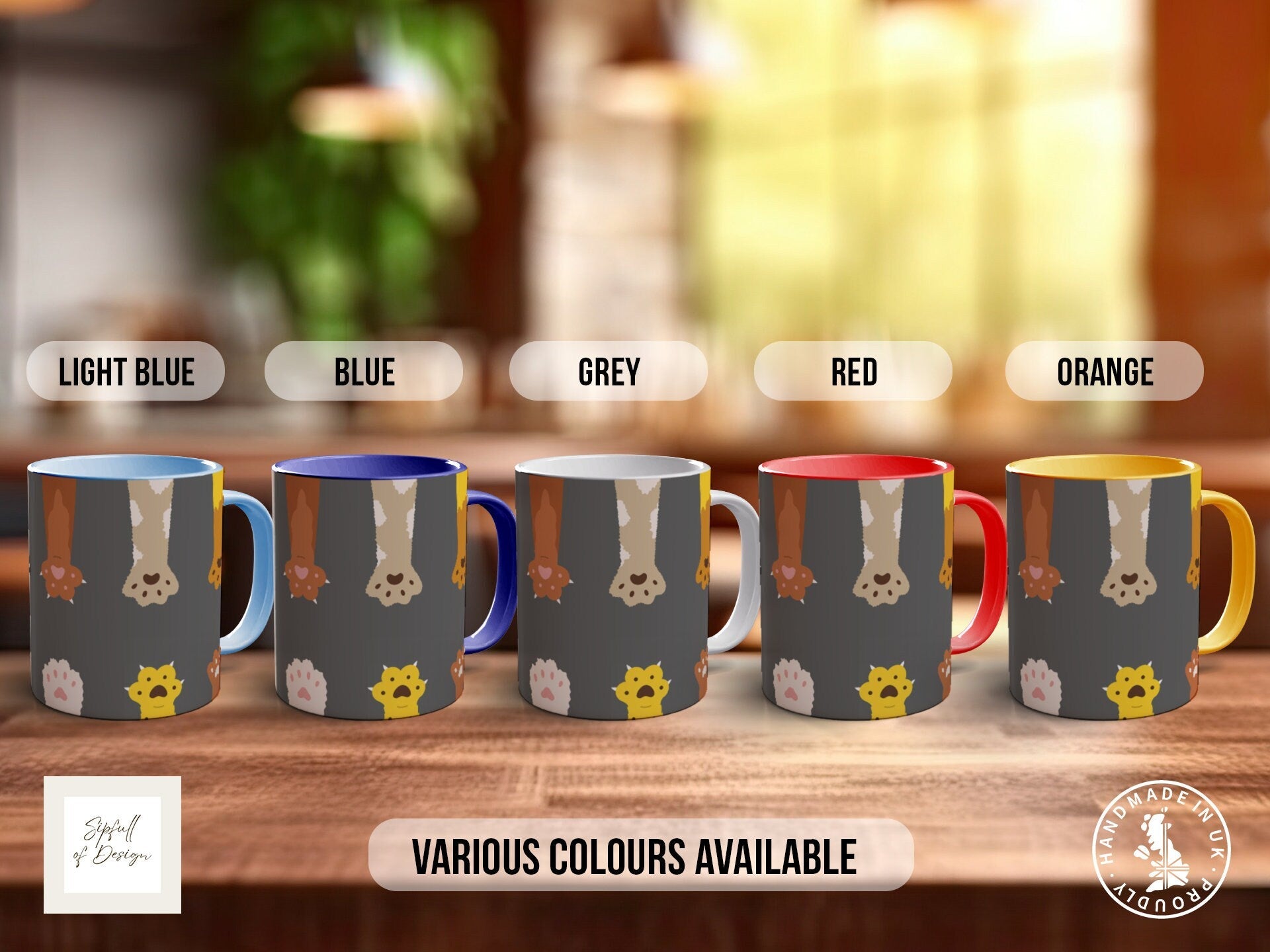 a group of five coffee mugs sitting on top of a wooden table