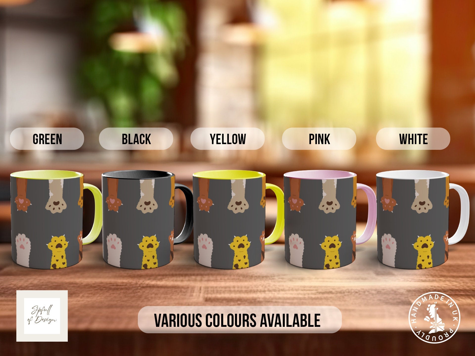 a set of four coffee mugs with different designs on them