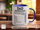 a blue and white coffee mug sitting on top of a wooden table