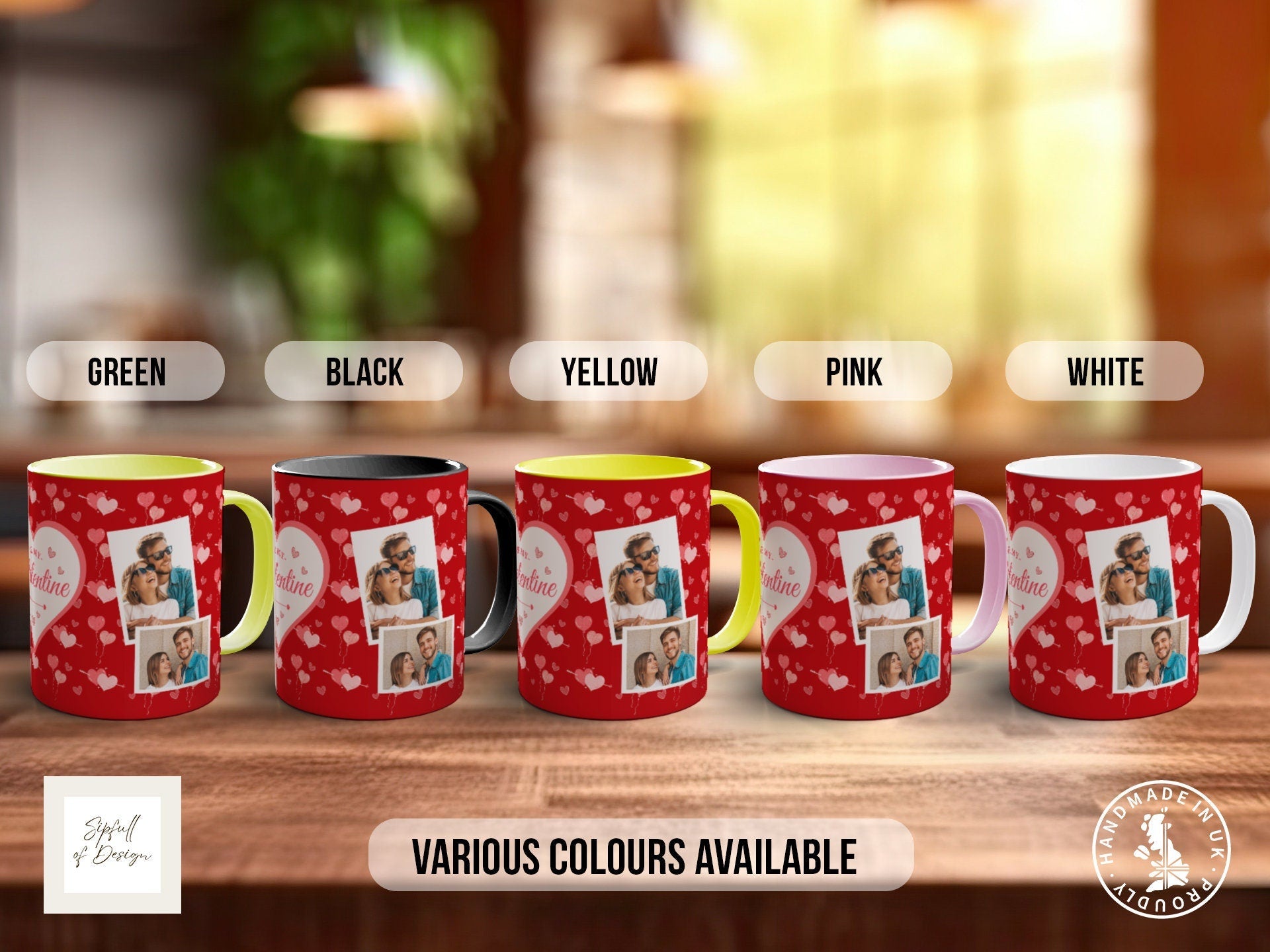 a group of four coffee mugs sitting on top of a wooden table