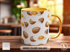 a yellow and white coffee mug sitting on top of a wooden table