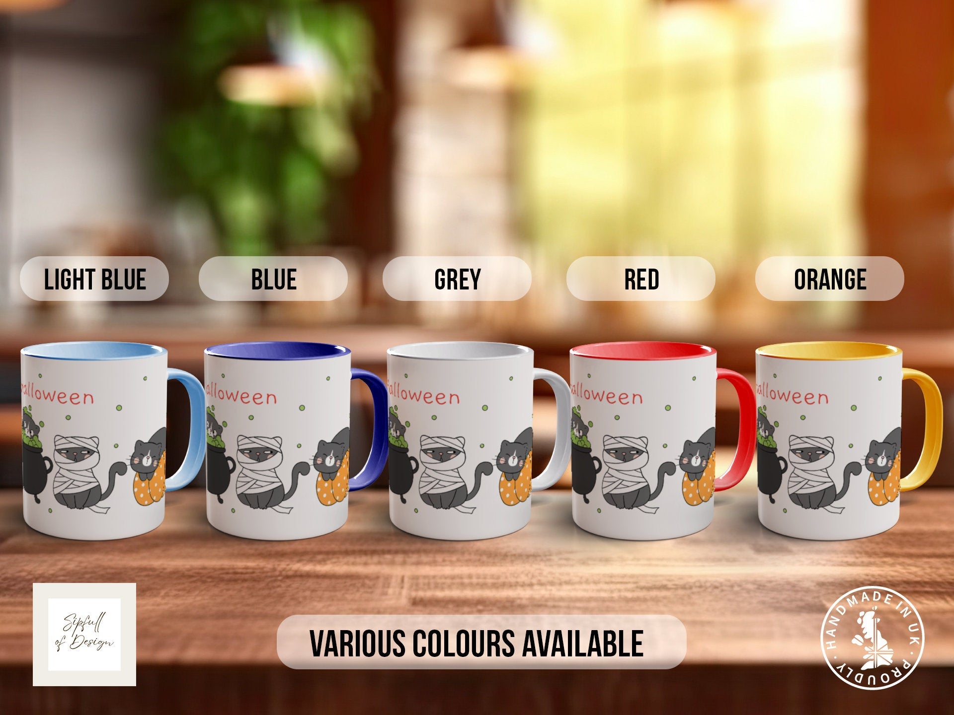 a group of four coffee mugs sitting on top of a wooden table