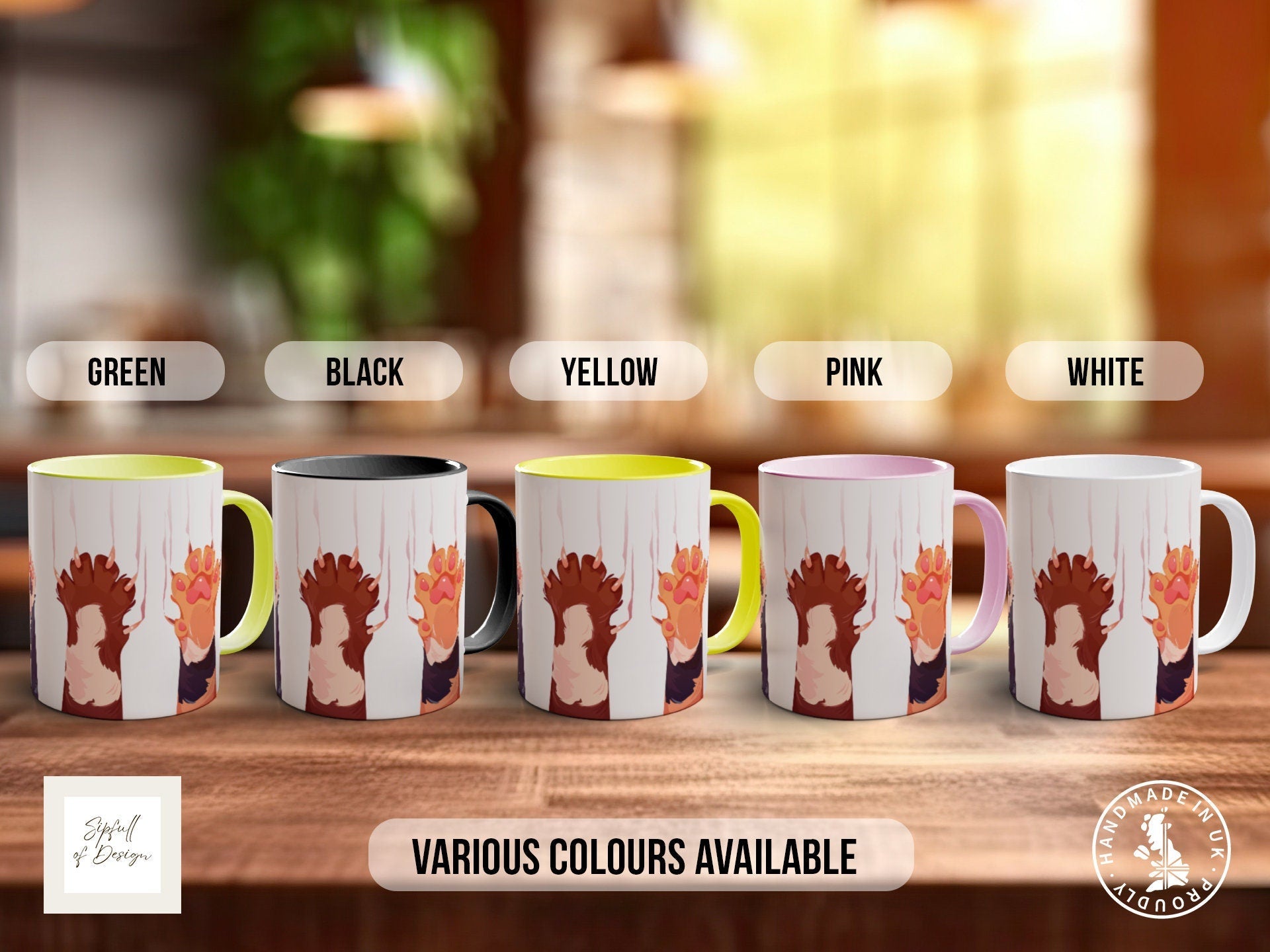a group of four coffee mugs sitting on top of a wooden table