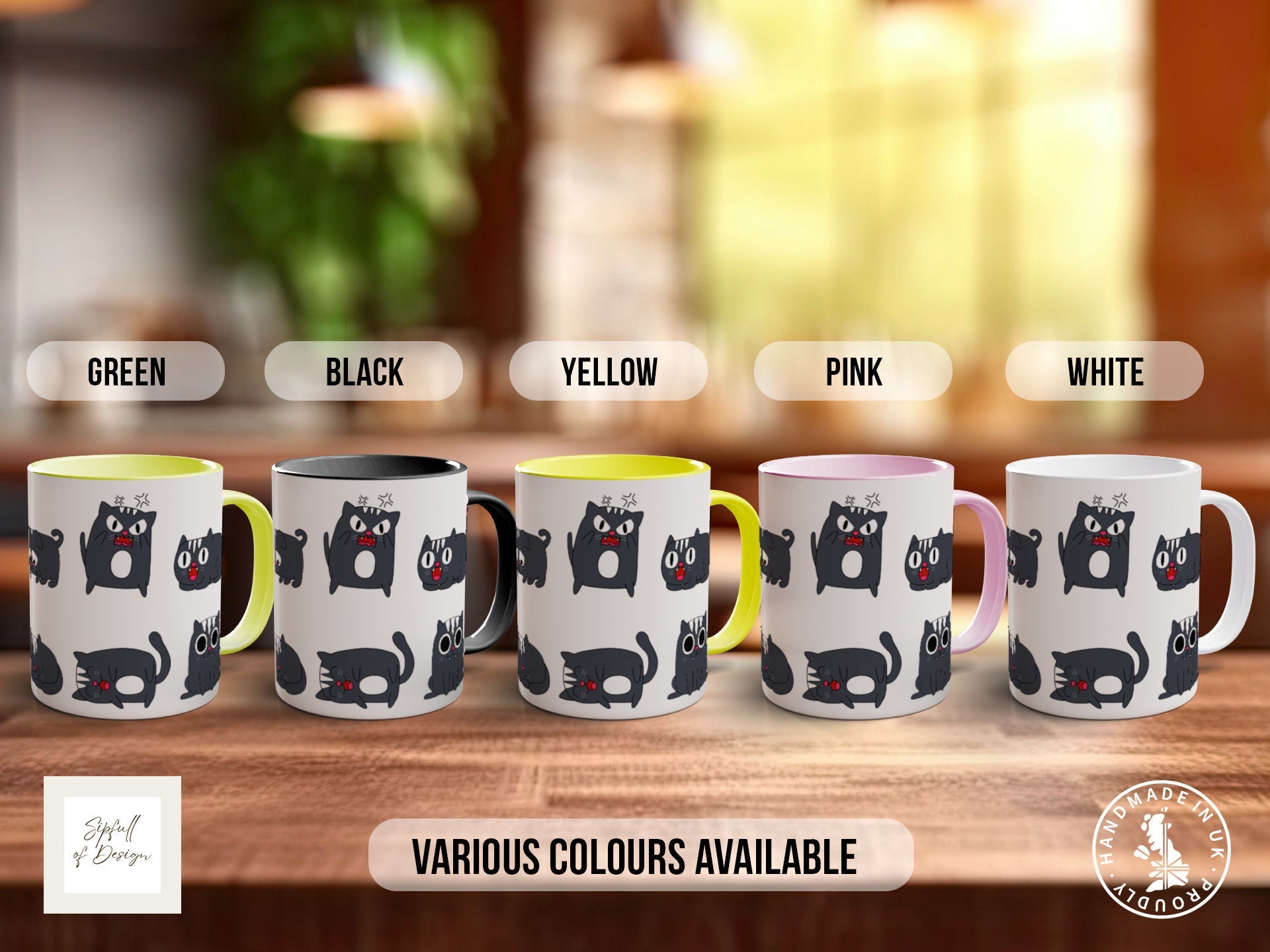 a group of four coffee mugs sitting on top of a wooden table